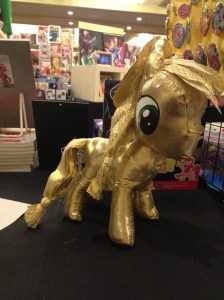 A gold lamé rag doll pony