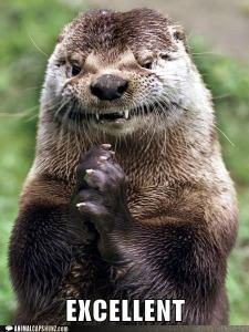 Close up of otter appearing to smile while holding his paws together.