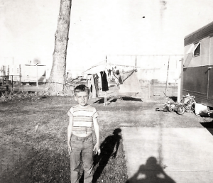 Me at age seven, being photographed by Mom's biological father.