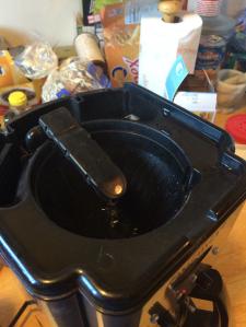 The old coffee maker, partially disassembled, and perking better than it has in a long time.