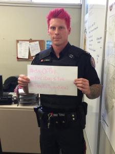 This is Officer LuKe Wilson of the Toronto Police Department, taking part in Pink Day, a day to take a stand against transphobic and homophopic bullying. His story is in the links.