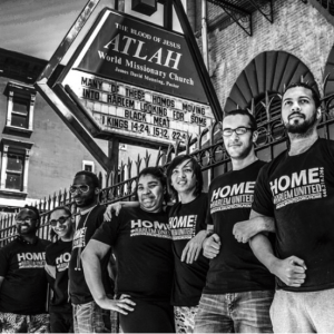 Harlem United's H.O.M.E Program Group taking a stand in front of the notorious Atlah church sign.