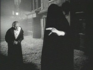 Alistair Sim meets the Ghost of Christmas Yet To Come in the 1951 "Scrooge."