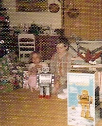My sister and I with our presents Christmas morning at my paternal grandparents; house.