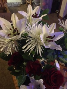 We got married four years ago on the first day that it was legal in our state, and I kept treating it as an elopement. My reasoning was that first, Michael and I had been together for over 15 years already, and we had very vague plans to try to do something more official later. Which we have failed to do. Anyway, some of our friends who were helping didn't take my casual attitude to heart, and they surprised us by decorating the home where we were doing it with a ton of beautiful flowers in Christmas colors, not to mention the surprise live music and so forth. So our wedding flower colors were white and red, so I buy Michael a Christmas-themed bouquet on our anniversary.