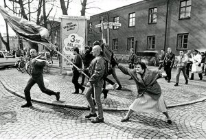 Danuta Danielsson, a woman of Polish and Jewish descent, caught on camera in 1985 by photographer Hans Runesson, hitting a marching neo-Nazi in the the head with her handbag on the streets of Växjö, Sweden.