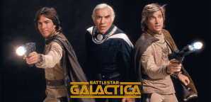 (l to r) Richard Hatch as Captain Apollo, Lorne Greene as Commander Adama, and Dirk Benedict as Starbuck. Promotional image from the original series. © 1978 Glen A. Larson Productions & Universal Television.