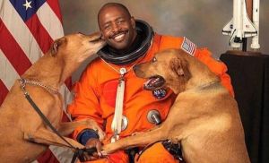 Retired astronaut Leland Melvin brought his rescue dogs, Jake and Scout to be in his official portrait. © 2009 NASA