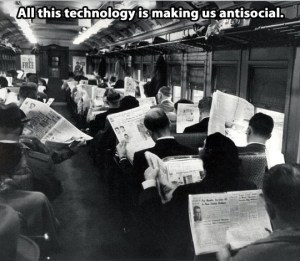 Photo of commuters on a train in the 1960s, everyone reading a newspaper with the caption: “All this technology is making us anti-social.” 