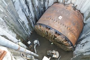 This is what the tunnel boring machine actually looked like during the second big delay, when they had to dig a big pit down to it to replace the big broken rotary head in 2015. (photo © WSDOT)