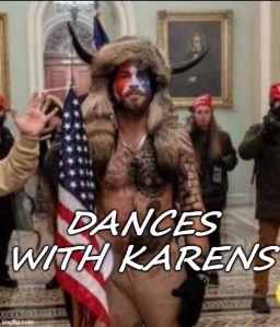 Picture of the QAnon Shaman inside the Capitol building during the murder mob riot, with the caption “Dances with Karens”